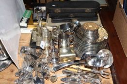 Quantity of silver plated flatware, place mats, cruet, castor, pepperettes, sauce boats,