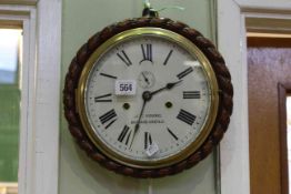 Circular oak cased wall clock, the dial signed J.T.