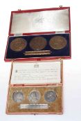 Two cased sets of commemorative medallions,