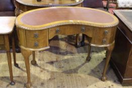 Walnut five drawer kidney shaped writing desk on ball and claw legs bearing label for A.G.