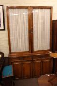 Late Victorian oak four door cabinet bookcase