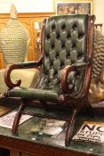 Deep buttoned green leather scroll armchair