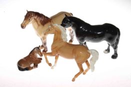 Four Beswick horses; Palomino, no. 1261; Highland Pony, no. 1644; Dartmoor Foal and Dales Pony, no.