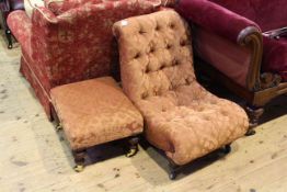 Deep buttoned nursing chair and turned leg footstool in matching fabric
