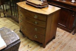 Regency mahogany bow front chest of four long graduated drawers on splayed legs, 82.5cm by 94.