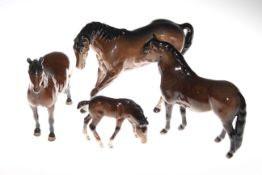 Four Beswick brown horses