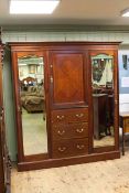Late 19th Century mahogany and chequer inlaid 6ft wardrobe having central cupboard door above three