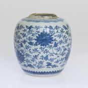 A CHINESE BLUE AND WHITE JAR, painted with lotus flowers and leafy scrolls,