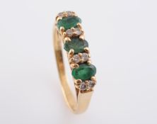 AN EMERALD AND DIAMOND RING,