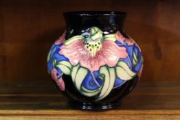A MOORCROFT "ANNA LILY" VASE, Christmas Market colourway, first quality.