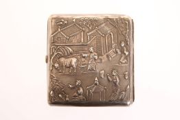 A CHINESE SILVER CIGARETTE CASE, chased with a village scene of figures, buildings and cattle,