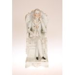 A 19TH CENTURY STAFFORDSHIRE FIGURE OF WELLINGTON, modelled seated with crossed legs,