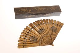 A CHINESE EXPORT LACQUER FAN, LATE 19th CENTURY, of twenty-three sticks including guards,
