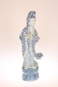 A LARGE CHINESE BLUE AND WHITE FIGURE OF QUAN YIN, modelled in flowing robes holding a bottle vase.