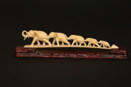 A JAPANESE IVORY ELEPHANT BRIDGE, MEIJI PERIOD, with five graduated carved elephants,