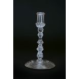 A MULTI-KNOPPED TAPERSTICK, CIRCA 1730-40, the nozzle with ring neck,