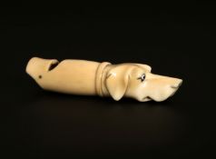 A 19TH CENTURY IVORY WHISTLE, carved in the form of a hound's head, (lacking an eye).