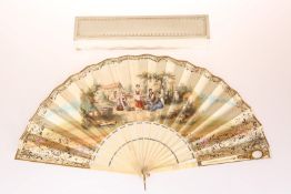 A BONE AND PRINTED FAN, with gilt framed mirror to the guard, numbered 5214 and initialled B.L.D.