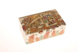 A JAPANESE SATSUMA BOX AND COVER, LATE MEIJI PERIOD, rectangular, painted with figures and foliage,