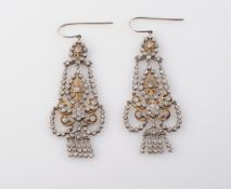 A PAIR OF DIAMOND SET EARRINGS, of an ornately articulated drop of swag and floral details,