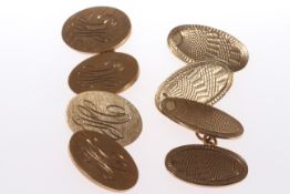 TWO PAIRS OF OVAL PLAQUE GOLD CUFFLINKS.