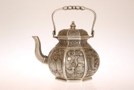 A CHINESE WHITE METAL TEAPOT, of octagonal panelled form,