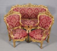 A STRIKING GILT AND UPHOLSTERED LOUNGE SUITE IN PERIOD STYLE,