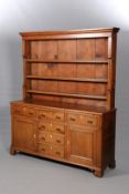 A GEORGE III OAK DRESSER AND RACK, the enclosed rack with moulded cornice,