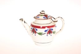 AN EARLY 19th CENTURY PEARLWARE TEAPOT, PROBABLY PORTOBELLO, in the characteristic palette,