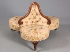A VICTORIAN WALNUT AND UPHOLSTERED LOVE SEAT, of trefoil outline,