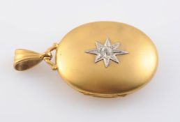 A MID VICTORIAN LOCKET PENDANT, of oval form hinged on one side,