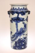 A CHINESE BLUE AND WHITE STICKSTAND, painted with phoenix and with moulded handles. 54.