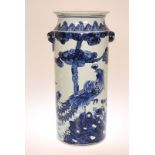 A CHINESE BLUE AND WHITE STICKSTAND, painted with phoenix and with moulded handles. 54.