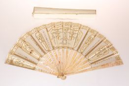 A MOTHER OF PEARL AND LACE FAN, with applied gilt details, in an Ernest Kees box. Spread 51.