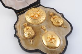 A MID VICTORIAN DEMI-PARURE, comprising locket pendant, locket brooch and a pair of earrings,