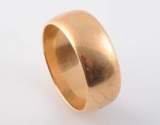 A LARGE GENTS GOLD RING, stamped 18. Ring size W. Weight 11.