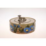 A LINTHORPE POTTERY BUTTER DISH, circular, enamel painted to the sides with flowers and foliage,