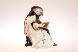 A BOW PORCELAIN FIGURE OF A SEATED NUN, CIRCA 1760, modelled seated,