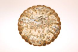 A SATSUMA DISH, MEIJI PERIOD, of circular form, with scalloped rim,