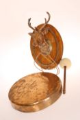 A LATE VICTORIAN COPPER AND BRASS STAGS HEAD DINNER GONG, mounted on an oak board and with beater.