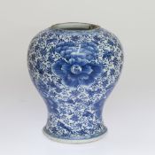 A CHINESE BLUE AND WHITE JAR, PROBABLY KANGXI PERIOD, painted with scrolling foliage and tendrils,