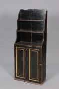 A REGENCY PAINTED PINE BOOKCASE CABINET, with waterfall shelves over a pair of fielded panel doors.
