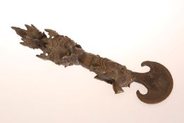 A TIBETAN BRONZE TRIGUG OR CEREMONIAL AXE, probably late 19th/early 20th century,