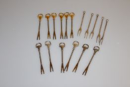 A GROUP OF ELEVEN VINTAGE GUCCI COCKTAIL FORKS, together with A SET OF SIX WMF COCKTAIL FORKS.
