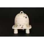 A FIRST PERIOD BELLEEK GRASS PATTERN HONEY POT AND COVER, in the form of a wicker skep on stand,