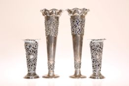 TWO PAIRS OF SILVER FLOWER VASES, the larger pair Chester 1904, the smaller pair London 1899.