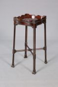 A 19TH CENTURY MAHOGANY URN STAND, IN CHIPPENDALE STYLE,