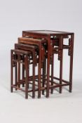 A SET OF FOUR CHINESE HARDWOOD NESTING TABLES, EARLY 20TH CENTURY,