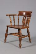 A 19TH CENTURY ELM SMOKERS BOW CHAIR, of characteristic form with baluster legs,