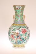 A CHINESE FAMILLE ROSE BOTTLE VASE, enamel painted with phoenix, birds and flowers. 36.